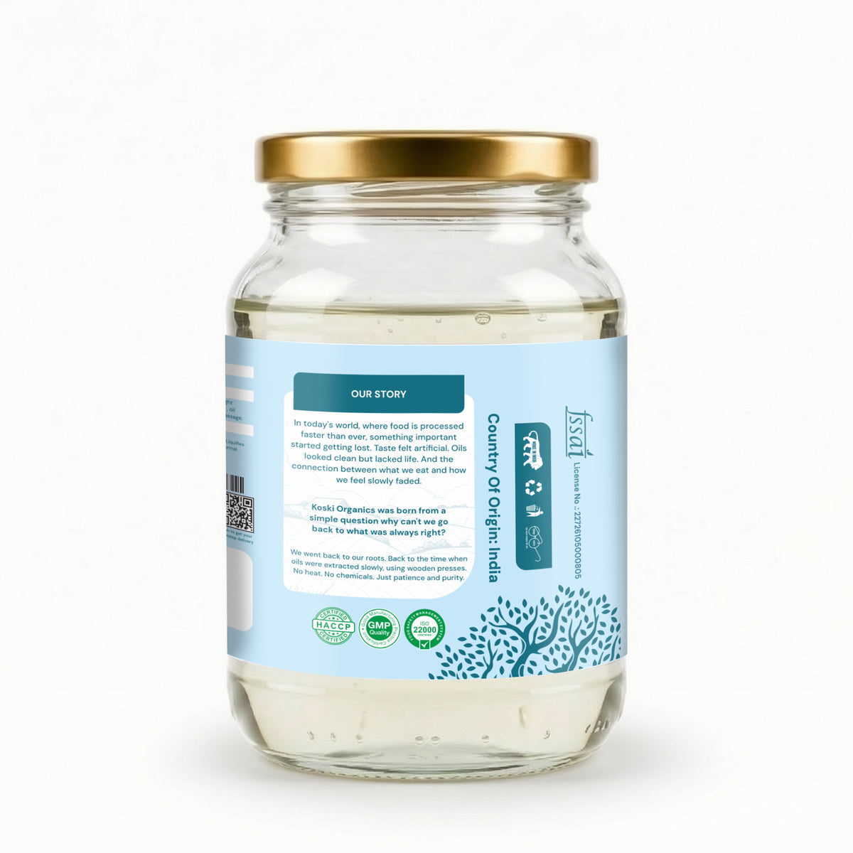 A clear glass jar of coconut oil with a gold metal lid and a light blue label, shown on a clean white background. The label features the brand name 'Safi' and text indicating 'Pure Organic Coconut Oil'