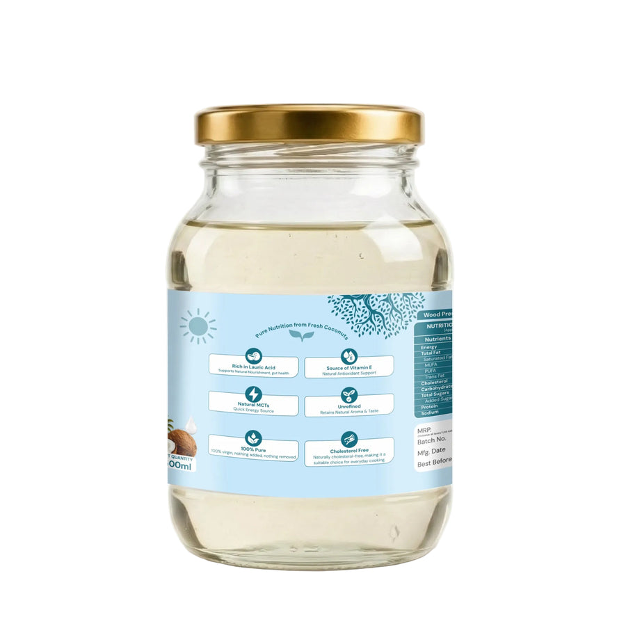 A 500ml glass jar of coconut oil with a gold metal lid and a light blue label, shown on a clean white background.