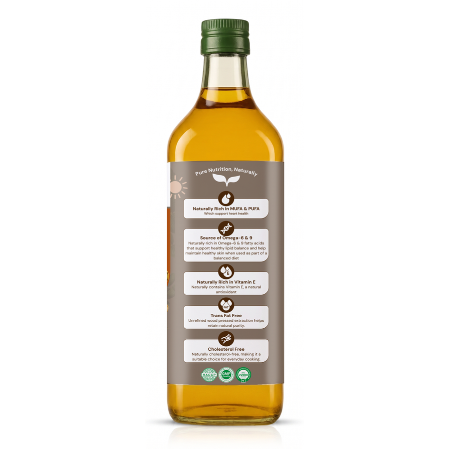 A bottle of golden yellow olive oil with a green cap and a brown label detailing product benefits, shown on a white background.