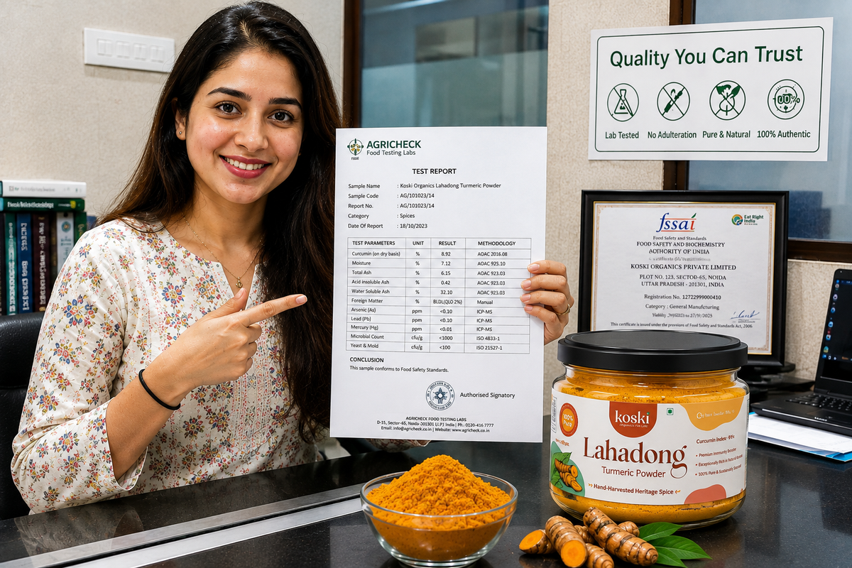 A woman in a floral blouse points to a test report sheet held up on a desk, with a jar of Konsi Lahadong Turmeric Powder and a bowl of orange turmeric powder in front of her. Behind her are certification documents and a 'Quality You Can Trust' sign.

Details