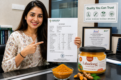 A woman in a floral blouse points to a test report sheet held up on a desk, with a jar of Konsi Lahadong Turmeric Powder and a bowl of orange turmeric powder in front of her. Behind her are certification documents and a 'Quality You Can Trust' sign.

Details