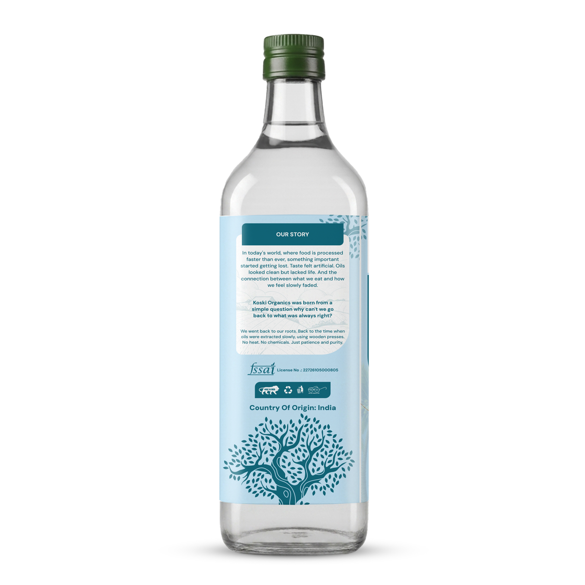 A clear glass bottle of Ayurvedic medicine with a dark green cap and a light blue label featuring a tree illustration, shown against a plain white background.