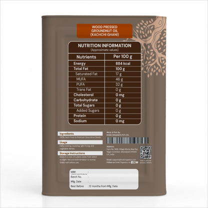 Back view of a cylindrical metal tin of Wood Pressed Groundnut Oil (Kachchi Ghani) showing the nutrition facts label, ingredients, and usage details on a white background.