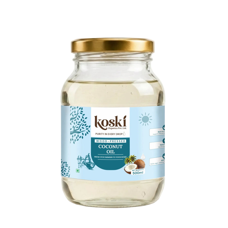 A 500ml glass jar of Kosái Coconut Oil with a gold metal lid and a light blue label, shown on a clean white background.