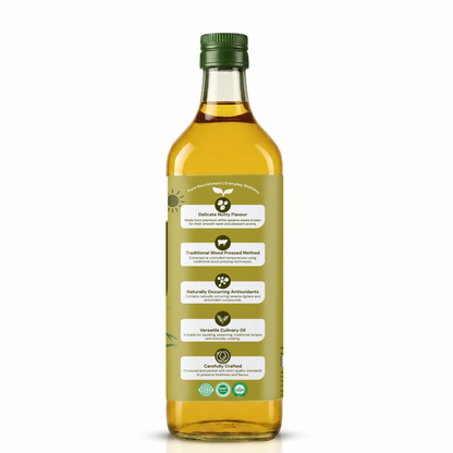 A bottle of vegetable sunflower oil with a green cap and a light olive-green label featuring white text boxes, set against a plain white background.
