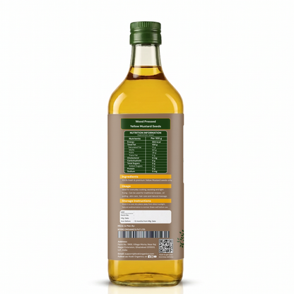 Back view of a 500ml glass bottle of Yellow Muskmel Oil with a brown label showing nutritional facts and ingredients, topped with a green cap, on a white background.